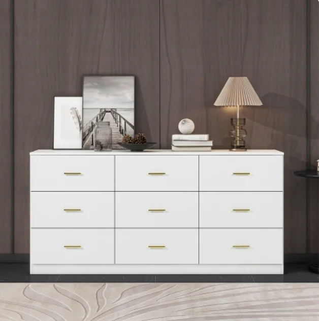 Modern white 9-drawer dresser with golden handles, sleek design, and ample storage for bedroom or living space